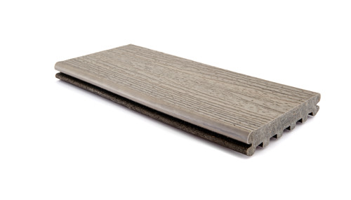 A profile view of a composite board.  The board is a gray color and the pattern on the surface closey resembles wood.