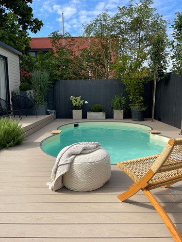 German Aneta Leban Pool Chair Ottoman Plants