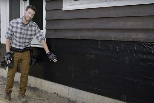 Man Showing Moisture Barrier