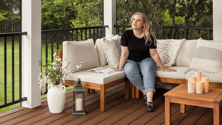 Image Porches And Patios Category Person Reading Happily On Their Composite Deck Porch 2X