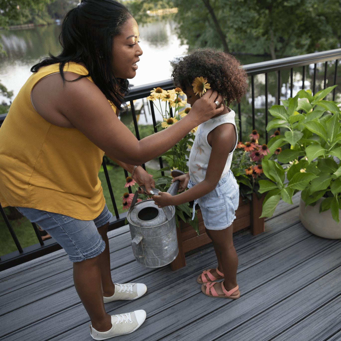 Image Parent And Child Watering Flowers On Composite Deck 2X