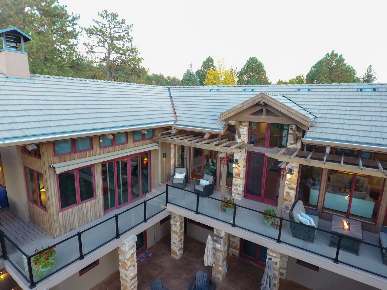 Second Story Wrap Around Deck With Glass Railing And Timber Framing
