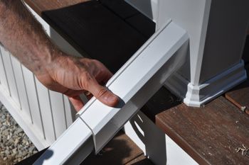 The rail follows the angle of the stairs.