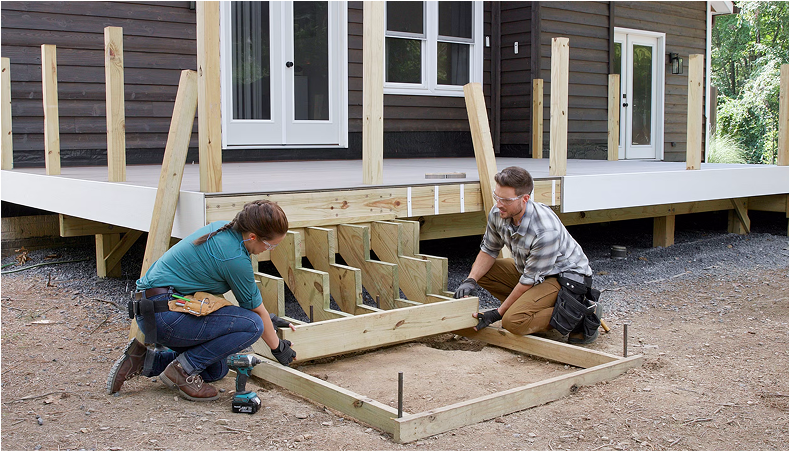Image Two People Building A Deck Staircase