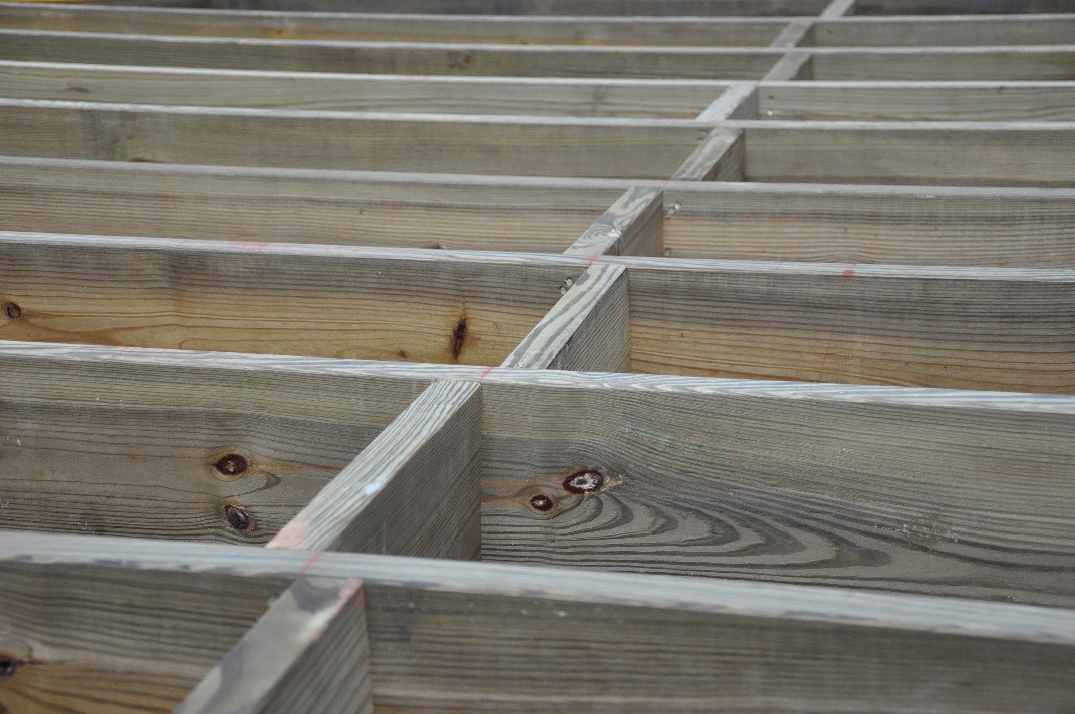 Reduce joist bounce with blocking.