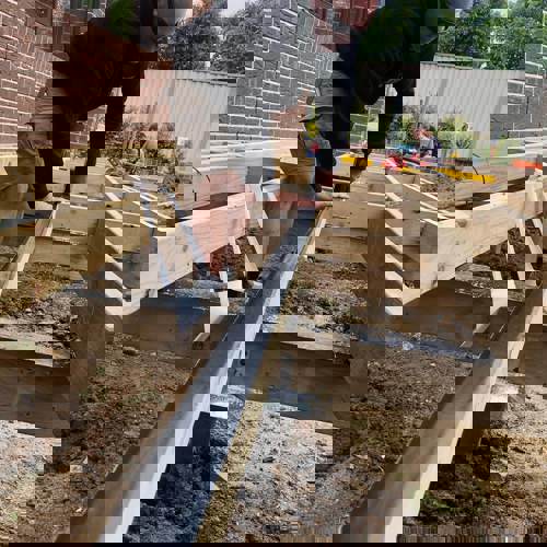 Person Applying Joist Tape