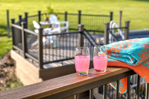 Cocktails Glasses Sitting On Top Of A Cocktail Railing