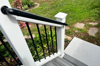 White Deck Railing With Black Hand Rail