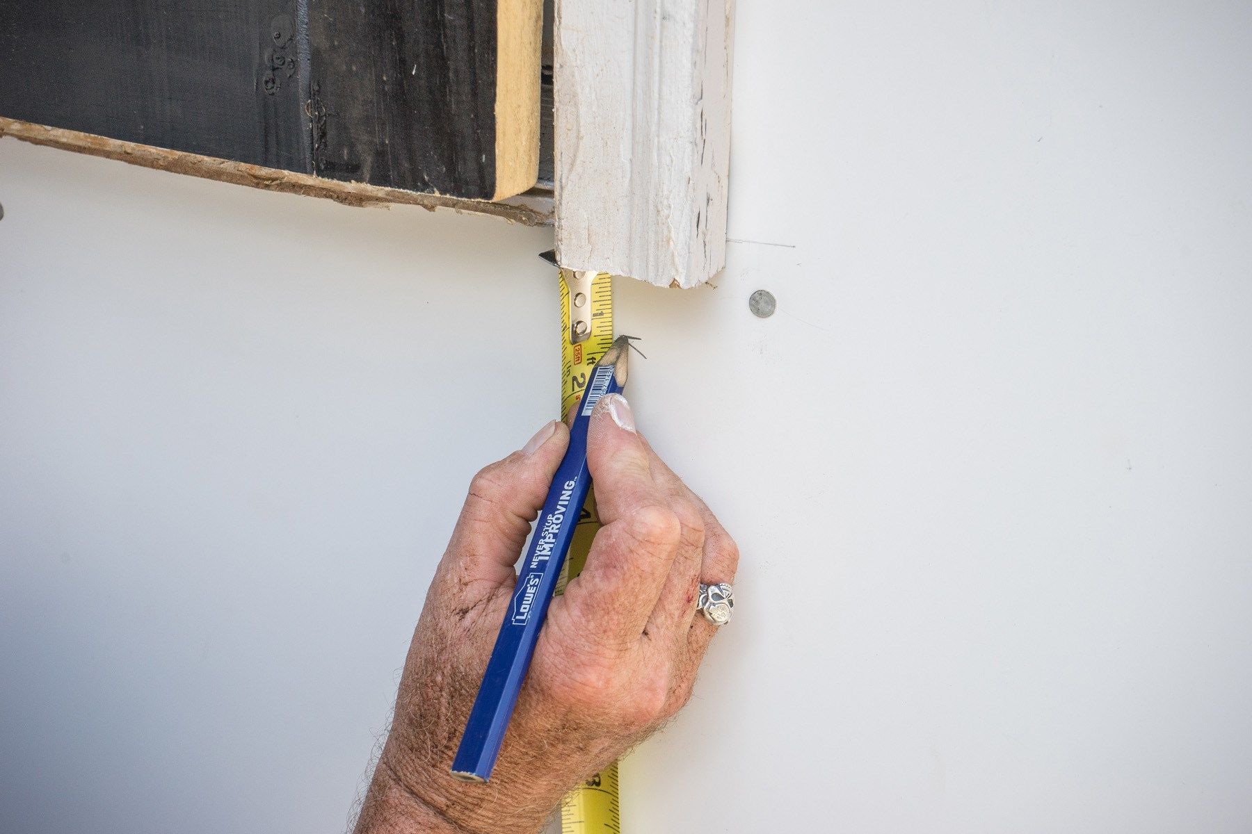 Mark below the door casing