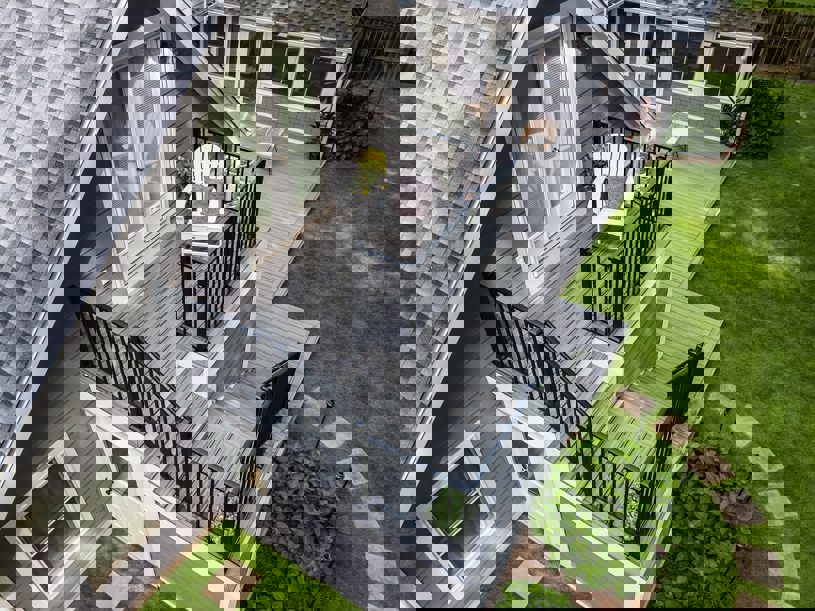 2nd level with a metal railing and a stone walkway